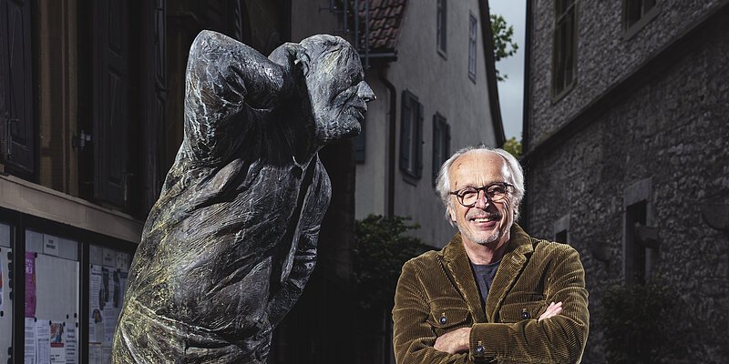 Header lebensgroße Bronzefigur mit Mensch
